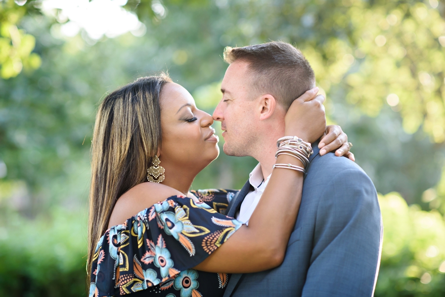 A bride to be kisses her fiance in the park in Hoboken, NJ.